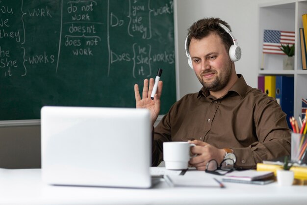 Teacher doing an english lesson online for his students