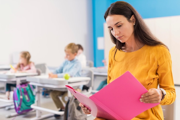 Teacher looking at her notes