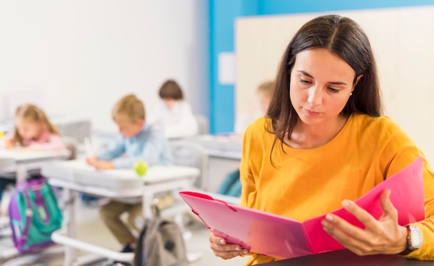 Teacher looking through her notes