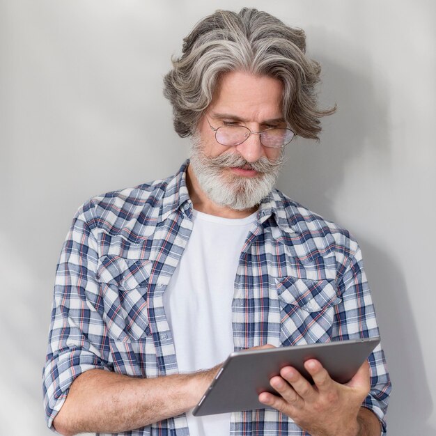 Teacher standing and holding tablet