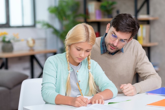 Free photo teacher and young student learning new lessons