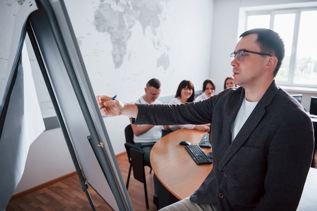 Free Photo teaching process. group of people at business conference in modern classroom at daytime