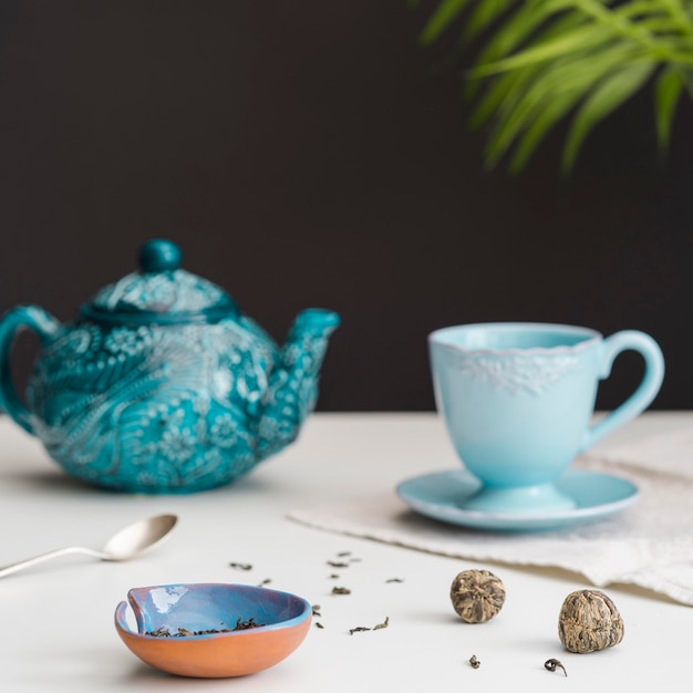 Free Photo teacup and teapot on table