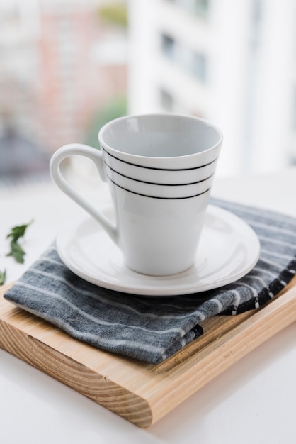 Free photo teacup on wooden board