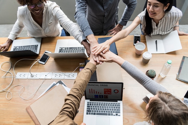 Free photo team of business people stacking hands