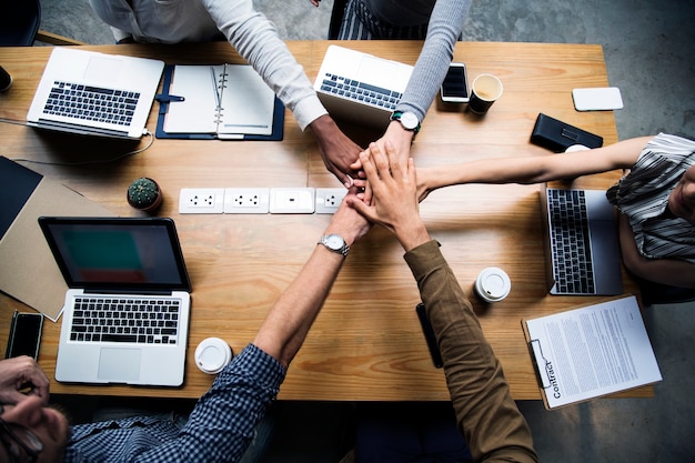 Free Photo team of business people stacking hands