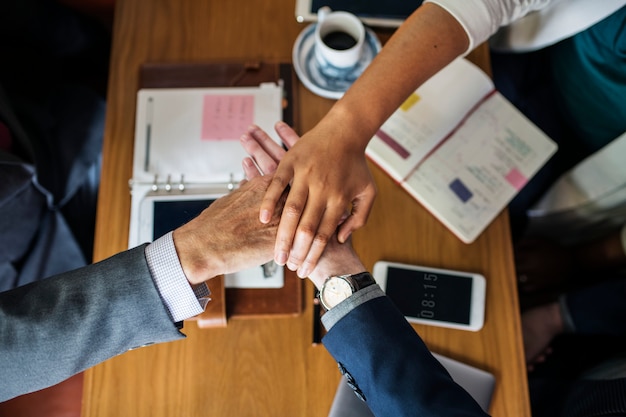 Free photo team of business people stacking hands