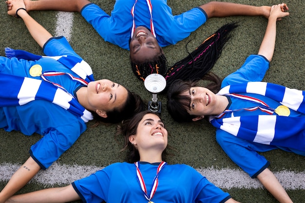 Free photo team celebrating the win of silver cup