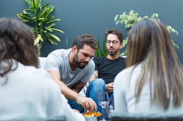 Free Photo team of friends enjoying wine and snacks