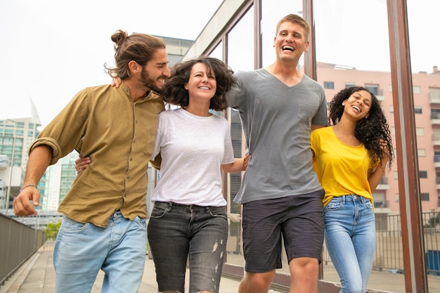 Team of joyful carefree friends having fun