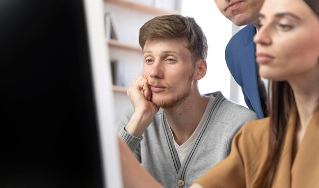 Team of professionals working on computer