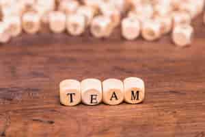 Free photo team word written on wooden blocks