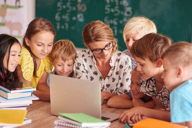 Teamwork over the teacher's laptop