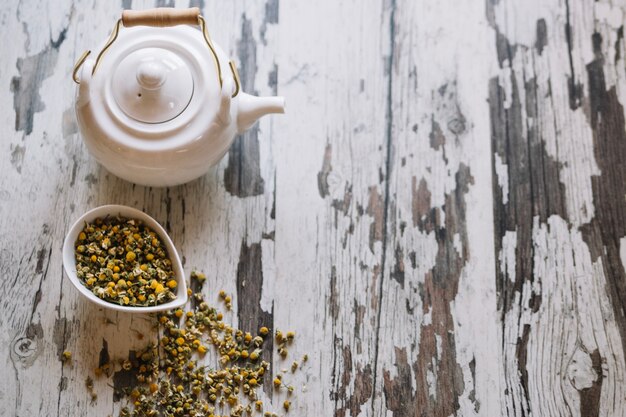 Teapot and dried chamomiles