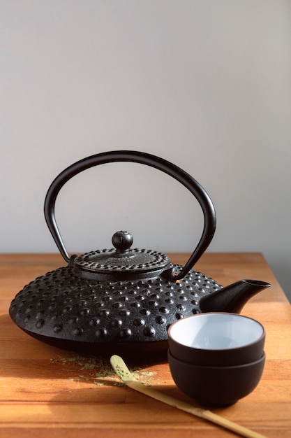 Teapot and tea set on wooden tray