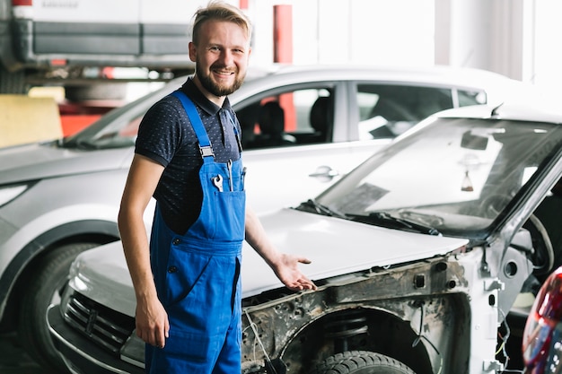 Technician smiling at garage