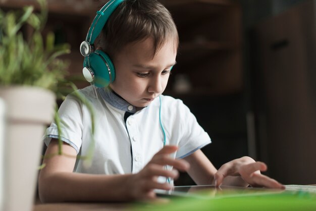 Technology concept with boy looking at tablet