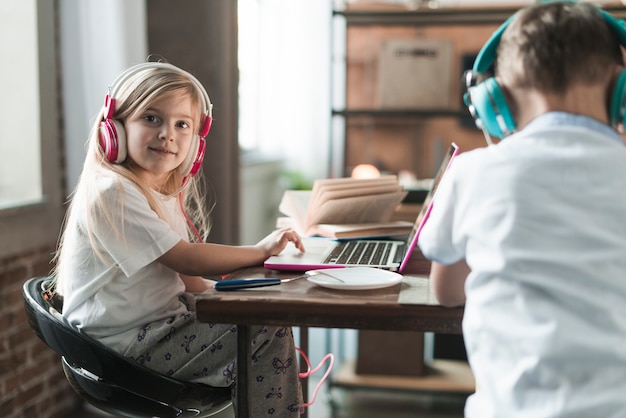 Technology concept with two kids at table