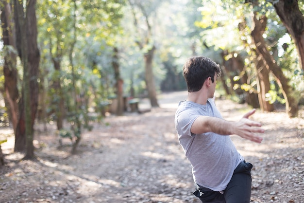 Teen doing warm-ups outdoors