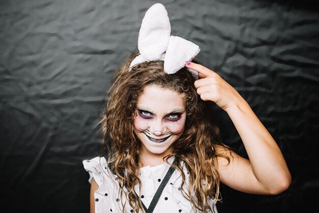 Teen girl with hare face paint