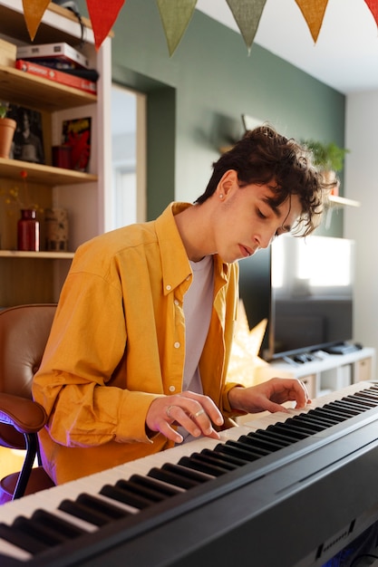 Teen playing the piano medium shot