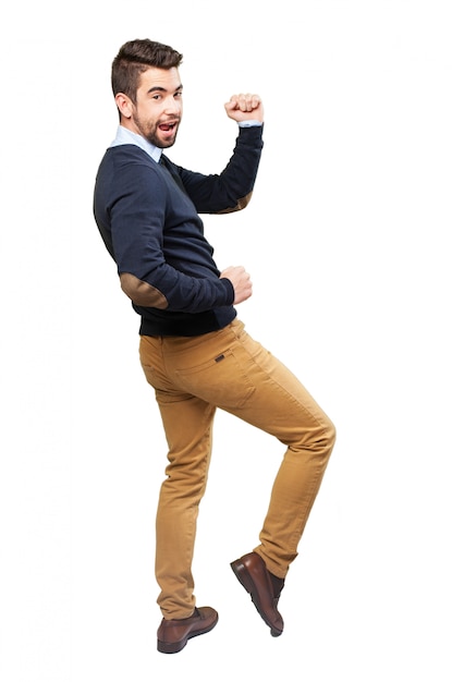 Teen waving his arms while dancing