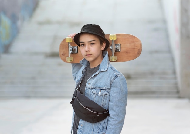 Teenage boy with skateboard