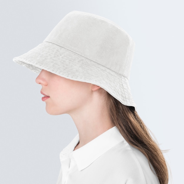 Free Photo teenage girl in beige bucket hat for street fashion shoot