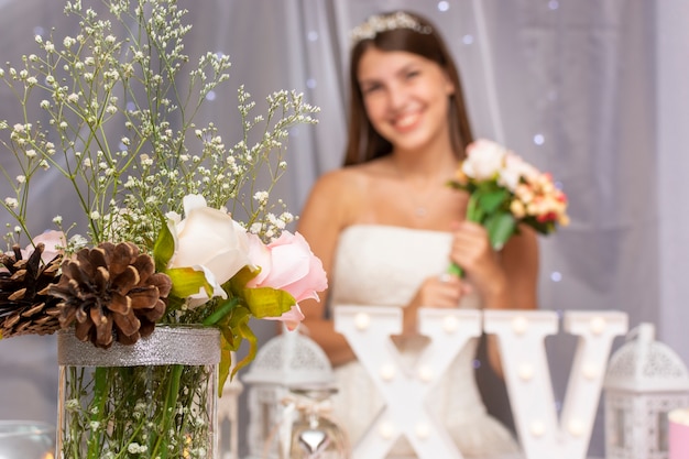 Free photo teenage girl celebrating quinceañera with cute arrangement