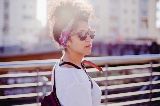 Free photo teenage girl in headband standing outside