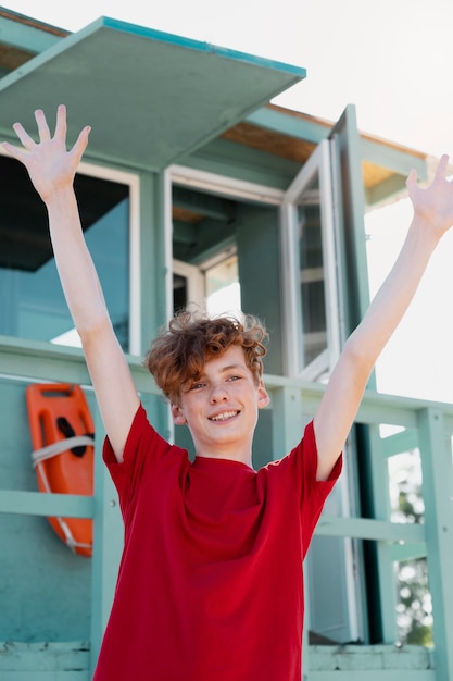 Free photo teenager boy having fun in the summer