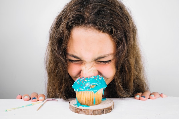 Teenager eating muffin