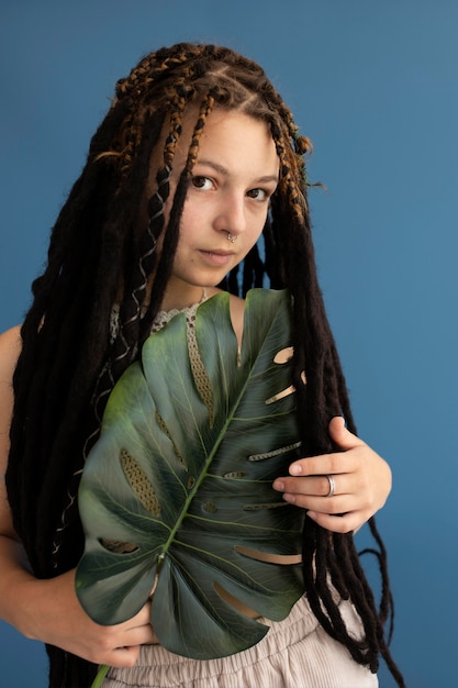 Free photo teenager girl with hippie clothes and dreadlocks