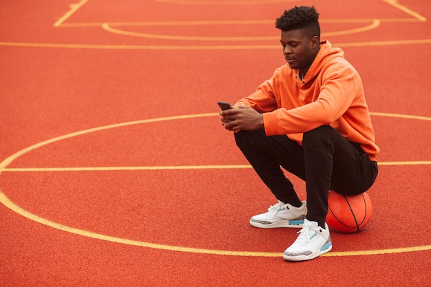 Teenager posing at the basketball field