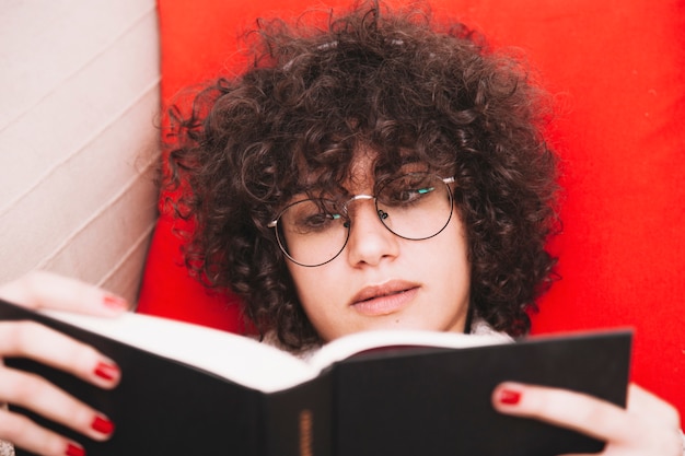 Teenager reading nice book