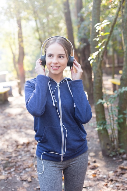 Free Photo teenager in sportswear walking through the park