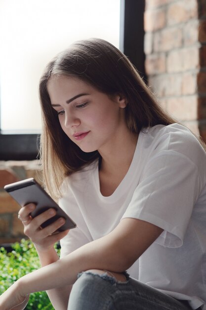 Teenager using mobile phones