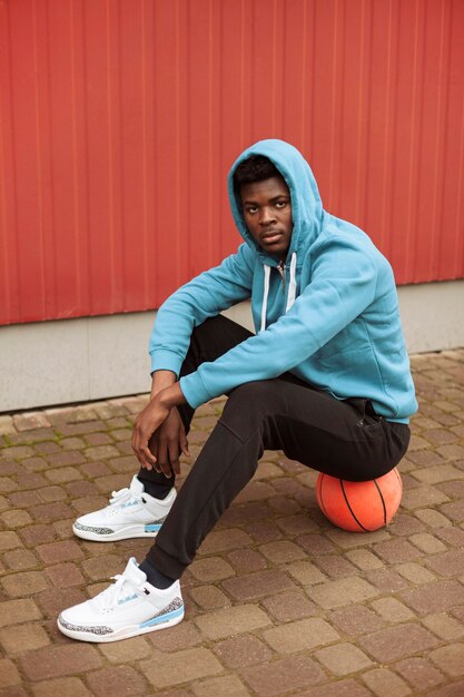 Teenager with a basketball ball