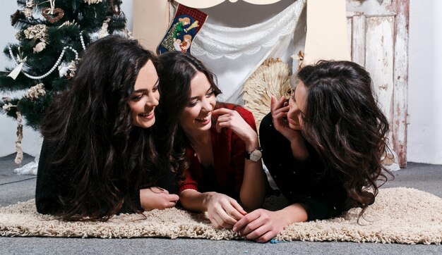 Teenagers lying on the floor and laughing