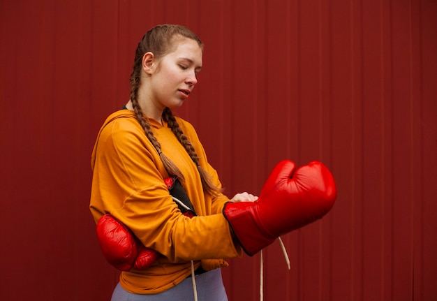 Free Photo teenagers posing with boxing gloves