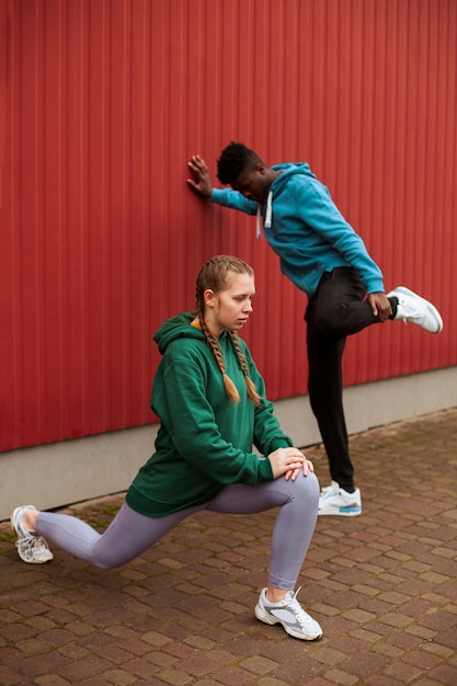 Teenagers training together outdoors