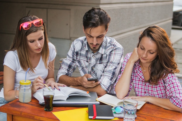 Teens studying and working together