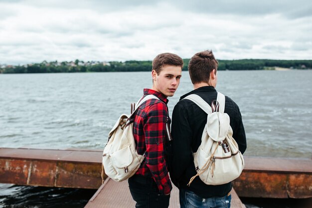 Teens with backpacks outdoors