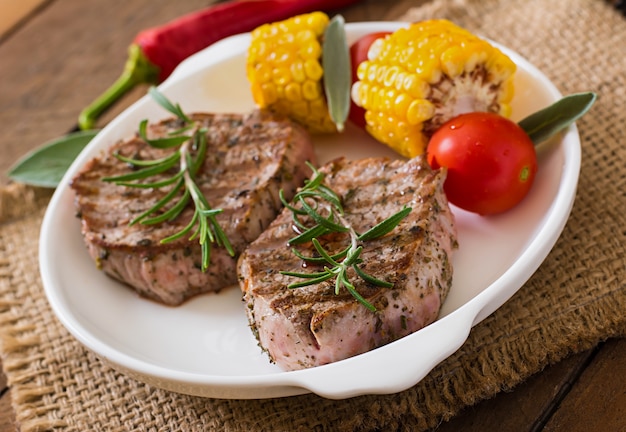 Tender and juicy veal steak medium rare with French fries