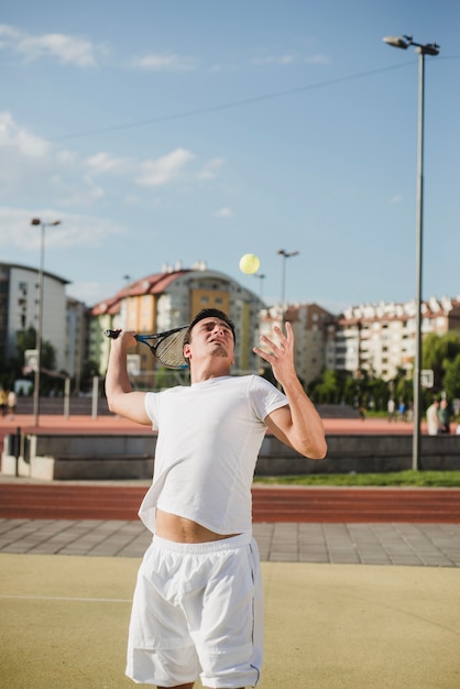 Free Photo tennis player hitting ball on court