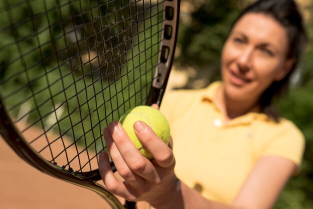 Tennis player with her racket