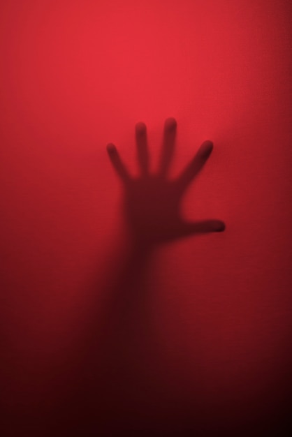 Free photo terrifying hand silhouette in studio