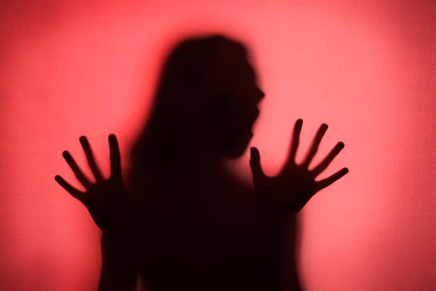 Terrifying hands silhouettes in studio