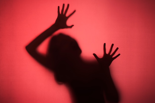 Free Photo terrifying hands silhouettes in studio