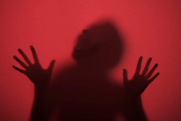 Terrifying hands silhouettes in studio